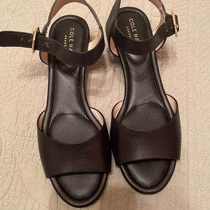 Cute “barely used” Cole Haan black sandals with small wedge heals. Size 5B.